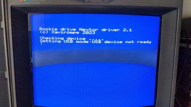 A Sony PVM with white on blue boot text from the Rookie cartridge:

Rookie driver Nextor driver 2.1
(c) Xavirompe 2023
Checking device .....
Setting USB mode: USB device not ready