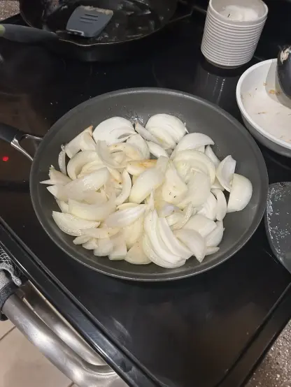 3 raw onions in a pan