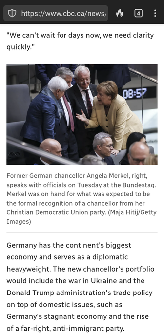 Photo from linked cbc article:

Among the seats at the Bundestag (German parliament): Angela Merkel, in a pale gold suit jacket, leans far forward over the back of some seats, speaking intensely with three grey-haired men in suits, who are looking and listening. Her open-hand gesture that suggests she's explaining something important.