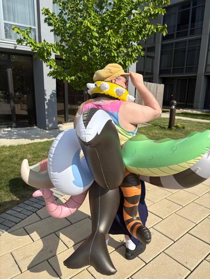 Me, wearing nine inflatable tails at once as well as an inflatable spiked collar (back angle)