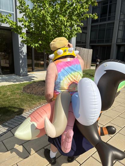 Me, wearing nine inflatable tails at once as well as an inflatable spiked collar (back angle 2)