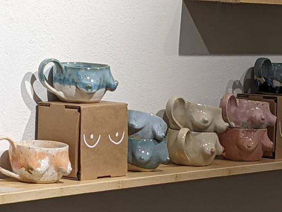 Artworks in a pottery with boobsified mugs