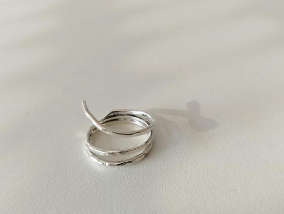 a double banded silver ring with hammered and glossy effects