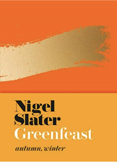 An orange cover with a gold painted flash across the orange. Golden yellow border on the bottom with black and white text.