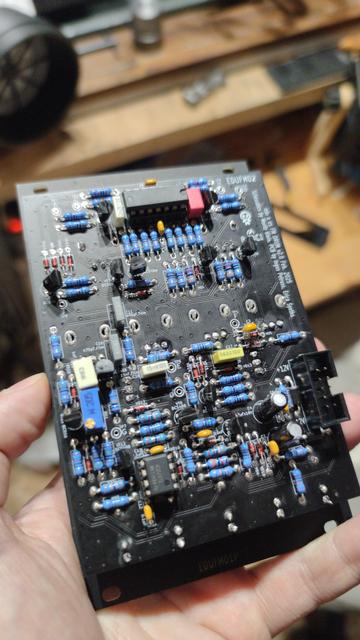 Circuit board back side of the fm dum with lots of different resistors, caps, transistors opamps.