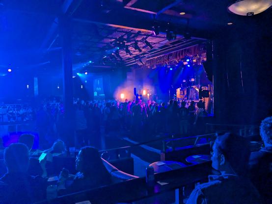 Shot of the stage in the dark before anyone is on stage yet, and crowd still gathering at The Commodor Ballroom in downtown Vancouver, BC