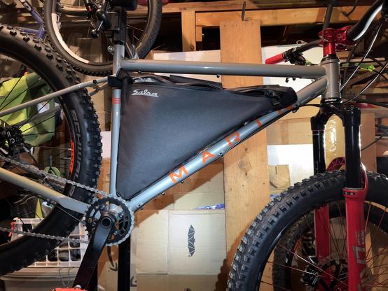 Detail of strap delete mock up on Surly triangle frame pack setup on my Marin Pine Mountain eTrail bike project build.