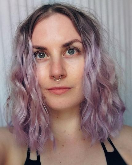 A selfie of a finnish woman looking at camera