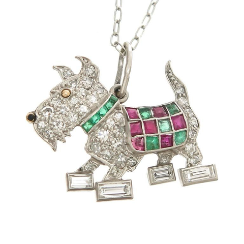 “This darling terrier is well turned out indeed, with a ruby-and-emerald plaid coat and diamond-baguette paws.” “set with Round and Fancy cut Diamonds and square cut Emeralds and Rubies” (official auction photo of item on plain white background)