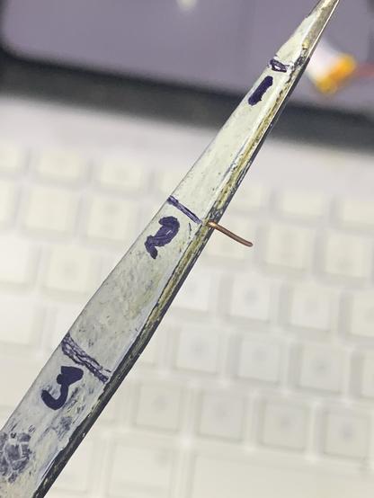 Tweezers marked with lines at the point where the width is one two and three times the pitch of the required bends