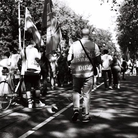 B&W image worker unions demonstrating on May first slogan on back of union member Turkish workers union ¨Samen zijn wij sterk, DIDF" (Together we are strong, DIDF).