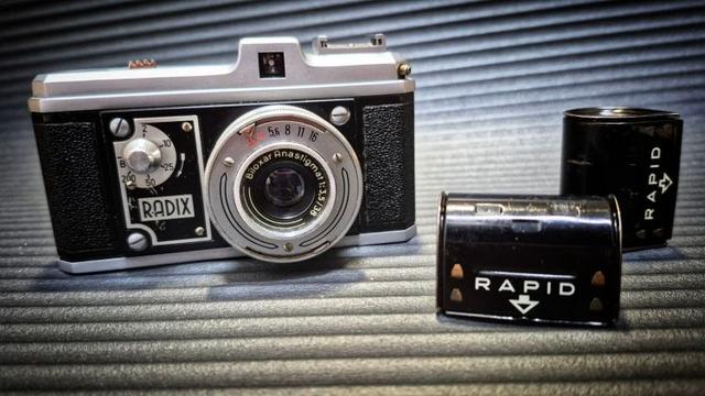 A Bilora Radix Karat format camera and two Rapid canisters.