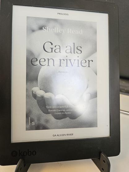 Book cover on ereader showing a hand with a peach