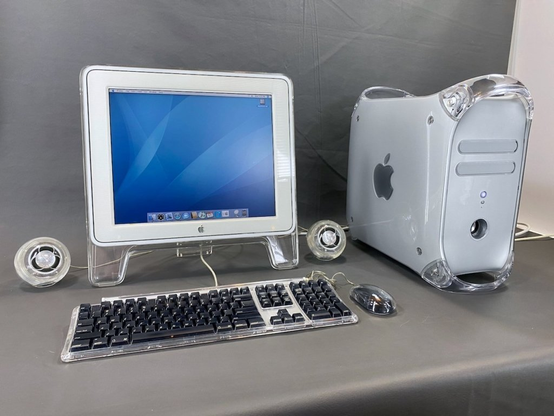 Picture of a Apple Macintosh G4 PowerMac "Quicksilver" computer system, with a flat screen LCD monitor, two globe speakers and a black/silver Apple keyboard and Magic mouse.

Source:
https://siliconfeatures.com/wp-content/uploads/2024/01/Power_Mac_G4_Mac_Server_G4_Quicksilver-1024x768.jpeg