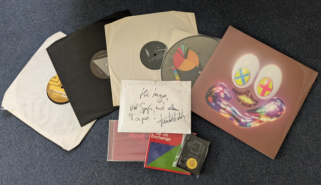 Three 12", a 10" picture disc, a vinyl album, two CDs and the tape I ordered.