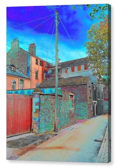 Very colourful, colour adjusted, portrait photograph showing a back lane of old terraced housing.  In the centre of the shot is a telegraph pole.  The image is shown printed upon a block canvas.