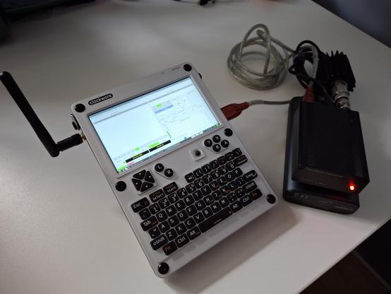 A clockwork pi uConsole hand computer running Debian and WSJT-X. Connected to a QRP Labs QDX Digital transceiver. All battery operated.