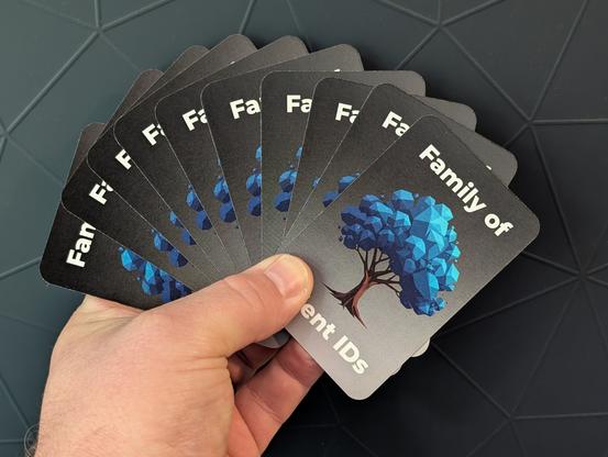 a card deck from the back, fanned out, reading "Family of Client IDs" with a tree in the middle