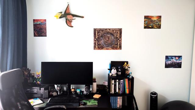 close up of the desk showing of the Elder Scrolls posters better as well as the cliffracer plush that's hanging on the wall because "cliffracers fly so high, in the sky, flying". also showing off some other merch better like Vocaloid, Spyro, OS・SCi, and OWASP, some Nintendo game & watches, and some other stuff.