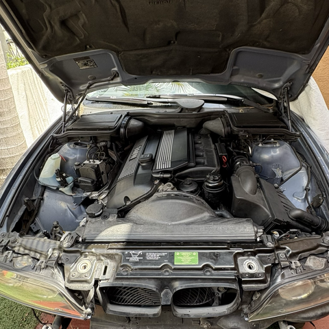 A view into the engine compartment of my blue 2003 BMW 530iT, which is now completely reassembled after installation of the replacement engine and transmission.