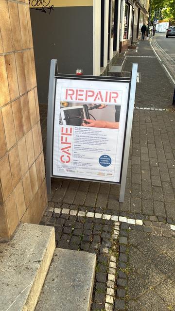 A poster announcing a repair cafe