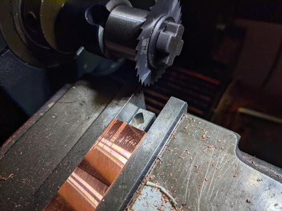 copper scrap in vice, in milling machine.
cutting blade is also shown.
