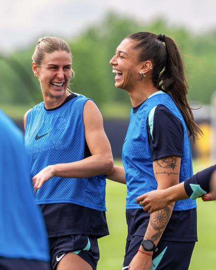 Zaneratto and Hopkins laughing during training