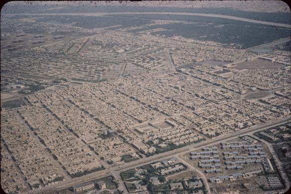 Aerial view of a desert city with the streets going out at interesting angles.