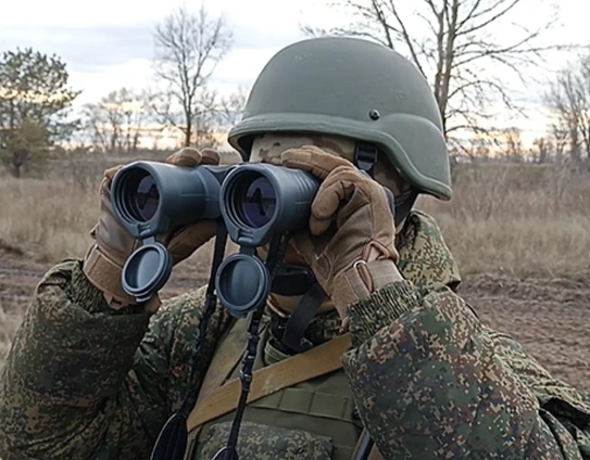 Russian Conscript looking for drones through binos