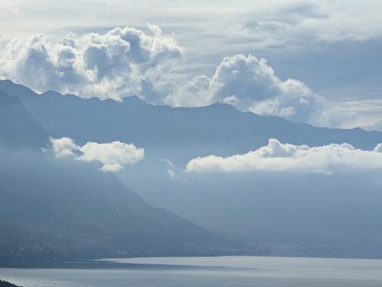Epic view of the Biokovo mountains with clouds and the still silvery surface of the Mediterranean