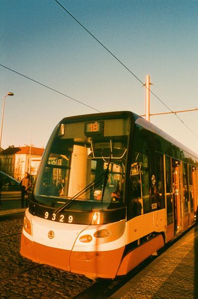A photo of a modern tram bathing in color shifted light