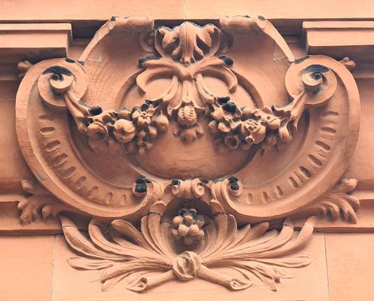 Sculptural details with garlands of fruit on an Edwardian building in Glasgow.