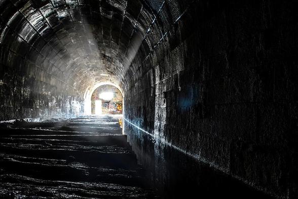 The Merriton Tunnel, also known as the Blue Ghost Tunnel, is an abandoned tunnel on the former Grand Trunk Railway running under the Welland Canal in Ontario.