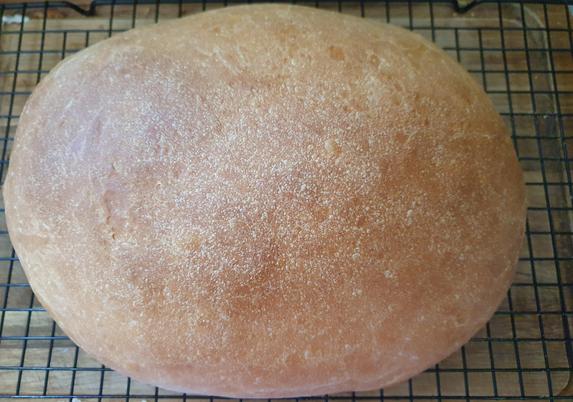 A rather rounded loaf of bread, basically I wasn't in the mood to put it in a loaf tin or shape it extravagantly, so it's an oval. Looks nice and golden, smells nice, hopefully it will taste nice, with some butter and jam on it.