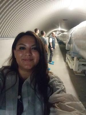 Teresita taking a selfie in a tour of the beam tube. It is shiny