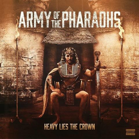 Album cover of "Heavy Lies the Crown" by Army of the Pharaohs. The artwork features an epic and imposing ancient Egyptian theme. A powerful figure dressed as a Pharaoh sits on a throne, holding a scepter, surrounded by stone pillars engraved with hieroglyphs. Torches flank the throne, casting a dramatic glow. The atmosphere is regal, dark, and commanding.