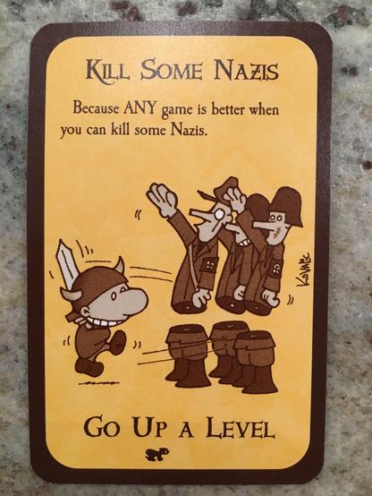 A brownscale Munchkin card with a yellow background. It depicts a small figure in a Viking hat with a sword cleaving three soldiers in Nazi uniforms in two. The first line of text reads “Kill Some Nazis”, the next “Because ANY game is better when you can kill some Nazis.” At the very bottom is the text “Go Up A Level”.