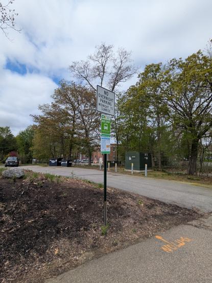 the signs at the church st parking lot bus stop in laconia, the furthest north stop on the route. it has the standard cat bus stop sign above a sign that shows the route map and times it serves the stop. above is another sign restricting overnight parking
