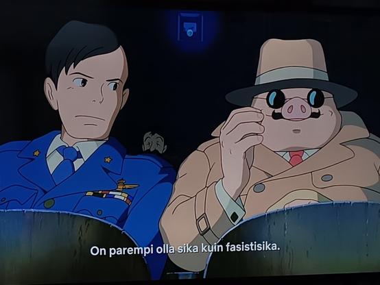 Kuva Porco Rosso animaatiosta, jossa lentäjäsankari sika sanoo upseerille "On parempi olla sika kuin fasistisika".