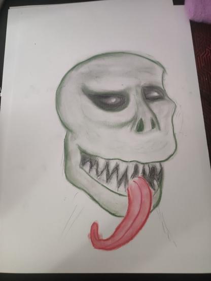 Some kind of green creature with sharp teeth and long tongue