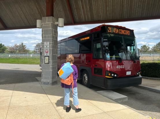 an mci in the red mta livery boarding at one of the concord coach berths in concord