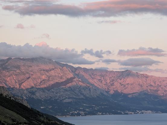 Biokovo mountain ranges glowing in late sunset light above the Dalmatian coast