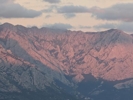 Biokovo mountain ranges glowing in pink late sunset light