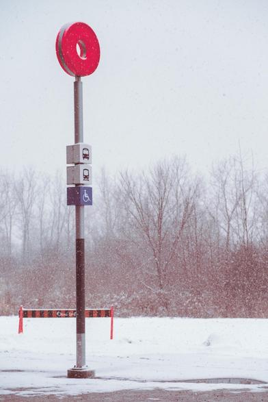 otrain roubdel in a snowstorm with a red tint