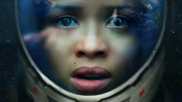 Gugu Mbatha-Raw in a space helmet staring straight into your soul.