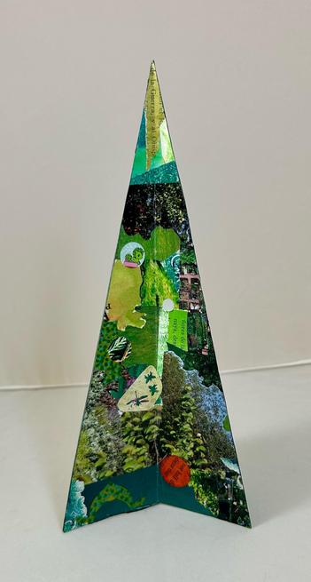 A tree shaped collage made with various shades and types of of green paper.