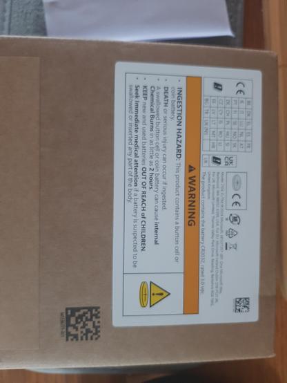 picture of a rather nondescript box, with health and safety label for containing a CR2032 battery

above that, it's labeled "model 2104" and "M1337357-001", 2024 microsoft, addresses for MS redmond (US), dublin (EU) and reading (UK)