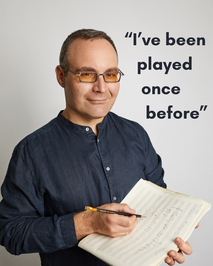 a portrait of Ljova holding a notebook of sheet music, with the pull quote "I've been played once before"
