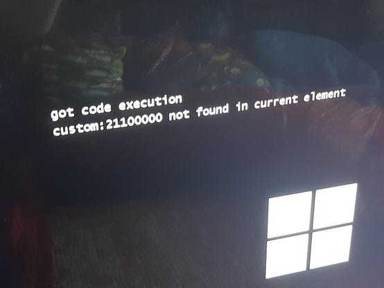 part of a black tv screen with a windows logo in bottom right and in the centre text "got code execution" in the windows boot environment font

shown reflected in the image is a couch with a bunch of cushions and a blahaj