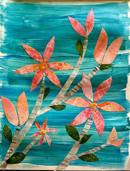 big, pink Magnolia blossoms, some fully bloomed, others still waiting to open with dark green leaves on a stormy blue  background